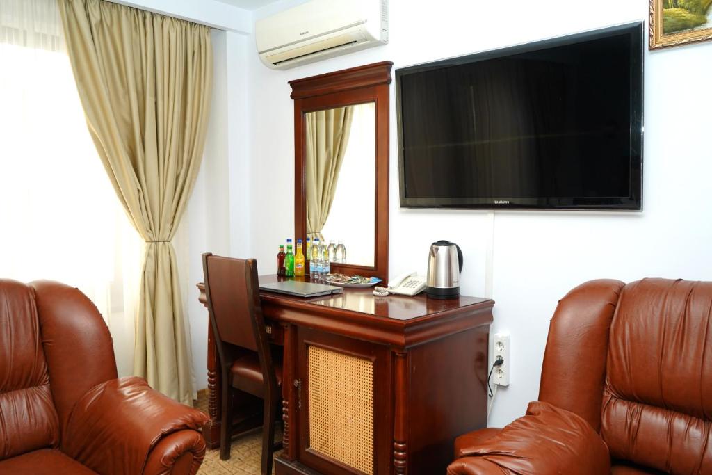 TV a/nebo společenská místnost v ubytování Hotel Bliss