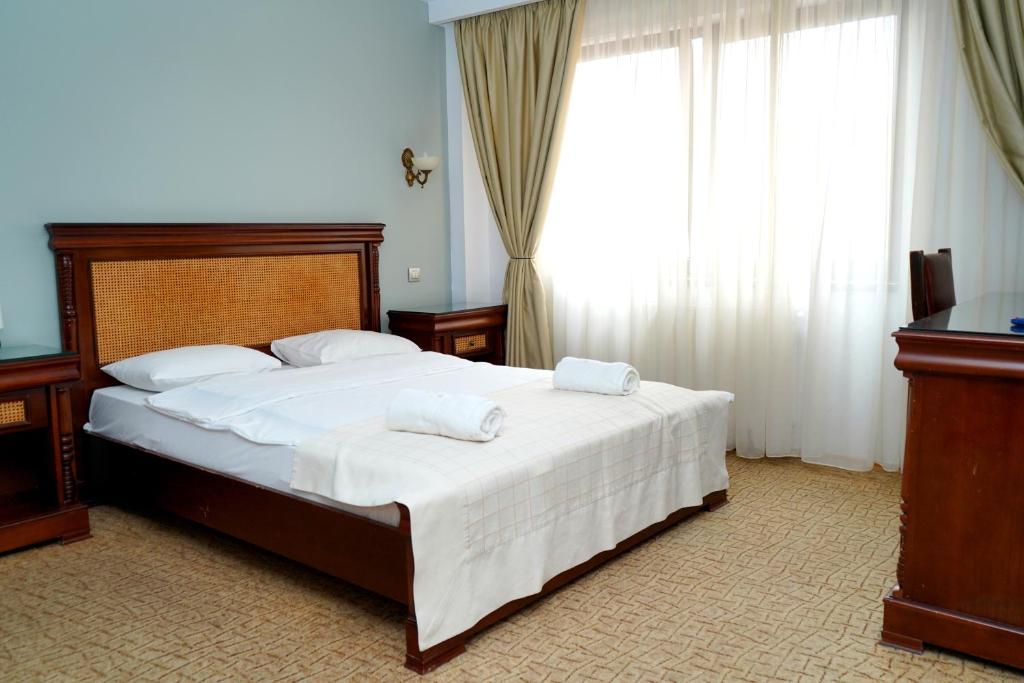 Postel nebo postele na pokoji v ubytování Hotel Bliss