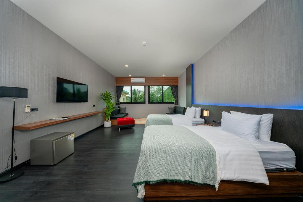 Postel nebo postele na pokoji v ubytování Happy Hotel Aonang Krabi