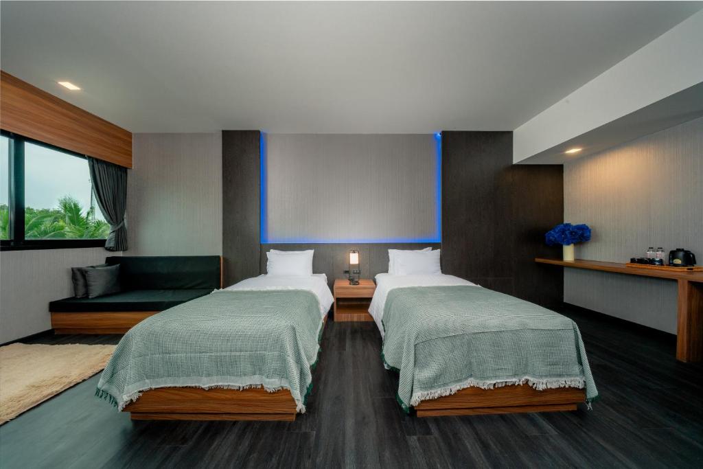 Postel nebo postele na pokoji v ubytování Happy Hotel Aonang Krabi