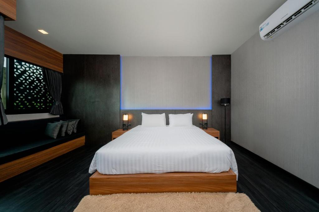 Postel nebo postele na pokoji v ubytování Happy Hotel Aonang Krabi