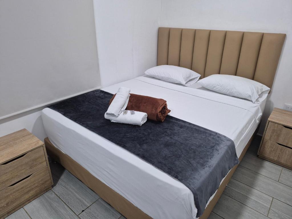 Postel nebo postele na pokoji v ubytování Hotel Brisas MEDELLIN
