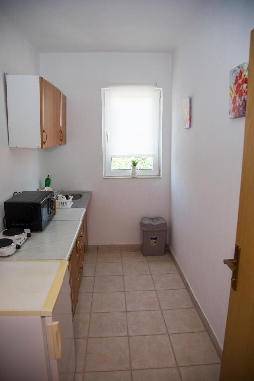 Kuchyň nebo kuchyňský kout v ubytování Guesthouse Bajric