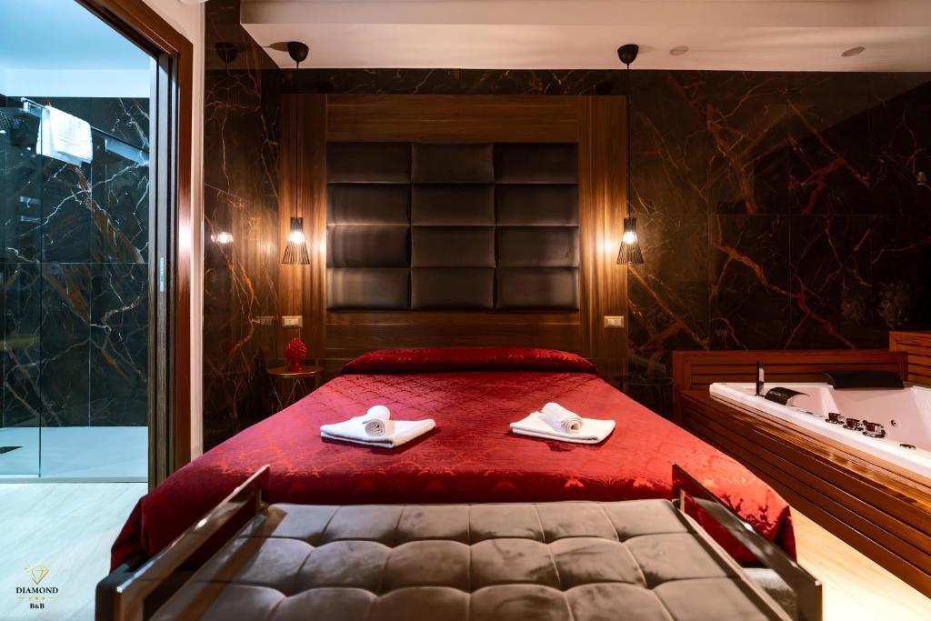 A bed or beds in a room at Diamond