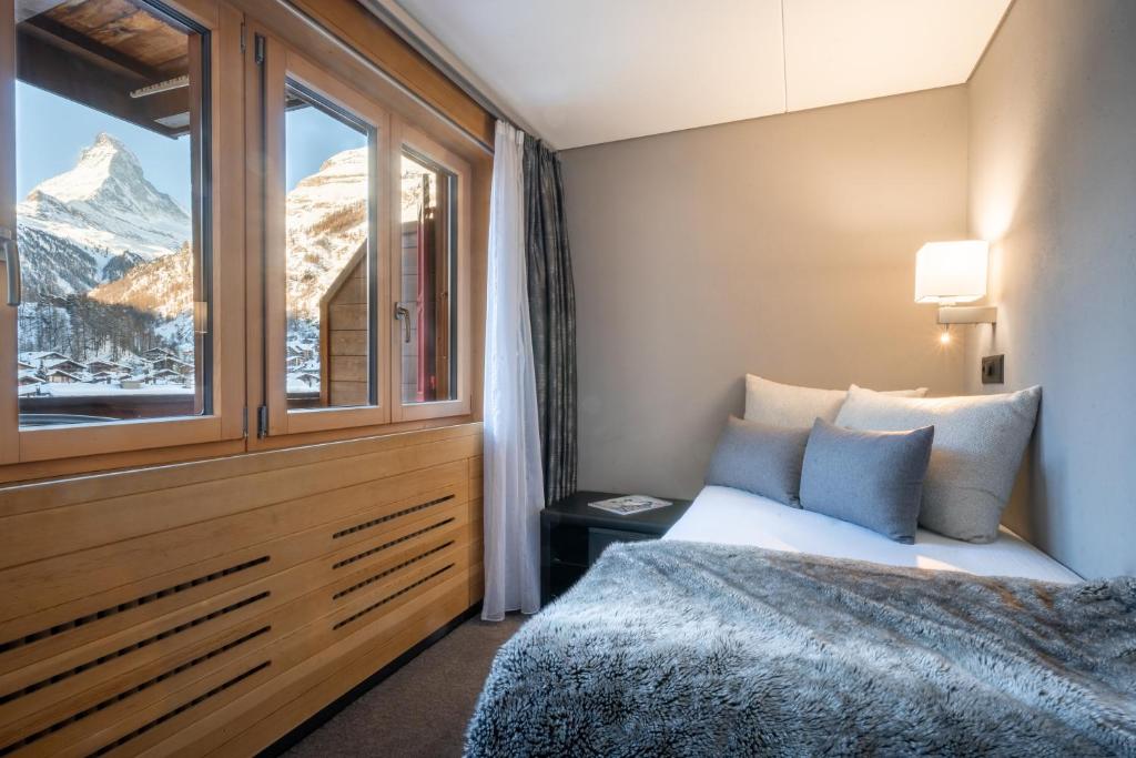 Ένα ή περισσότερα κρεβάτια σε δωμάτιο στο Hotel AMBiANCE