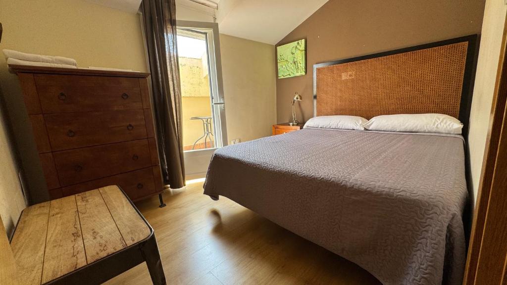 Postel nebo postele na pokoji v ubytování Apartamentos Alcazar de Baeza