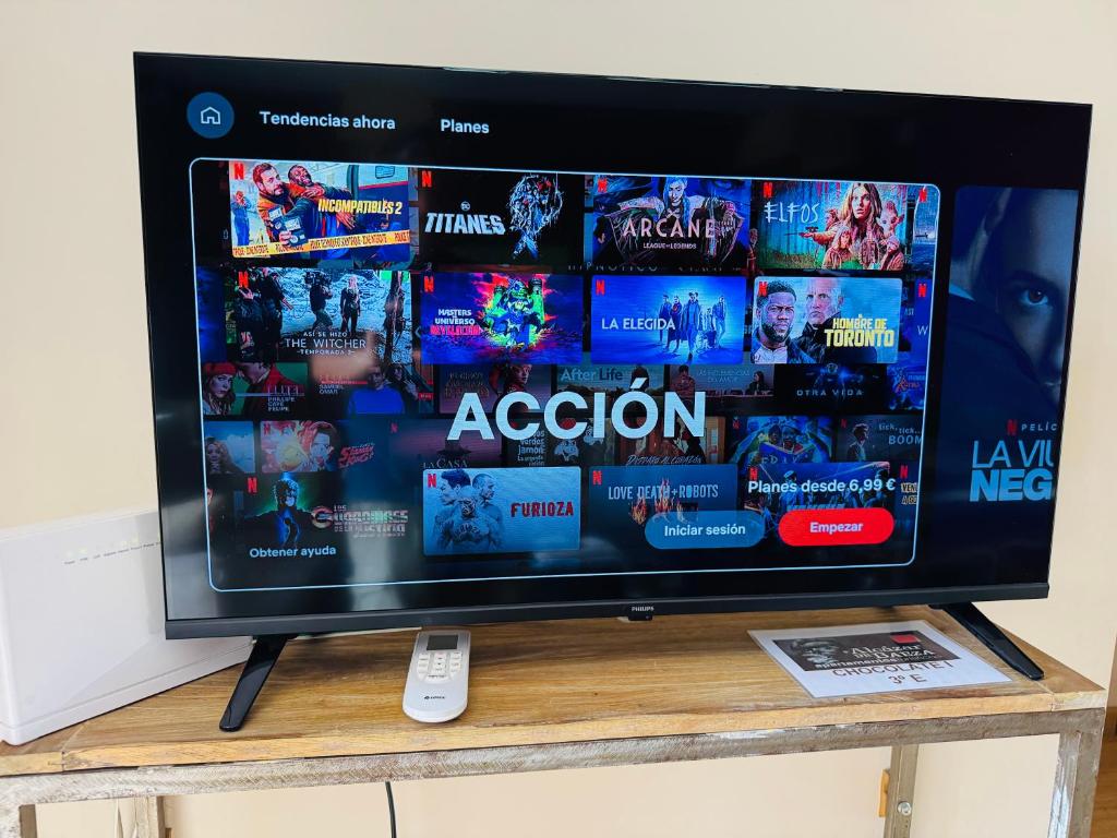 TV a/nebo společenská místnost v ubytování Apartamentos Alcazar de Baeza