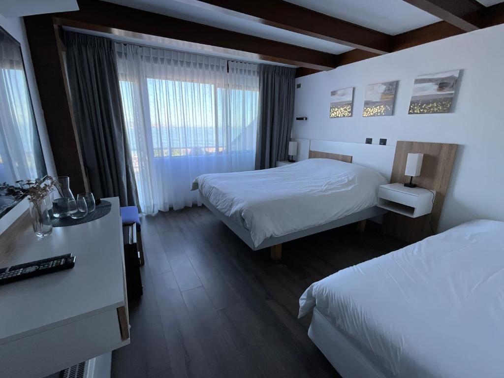 Postel nebo postele na pokoji v ubytování Hotel Camino del Alto Reñaca