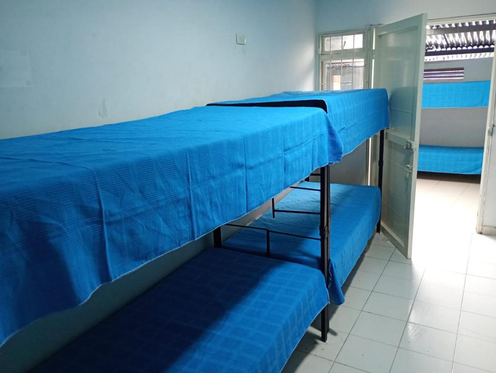 Postel nebo postele na pokoji v ubytování Interlaken Ibagué