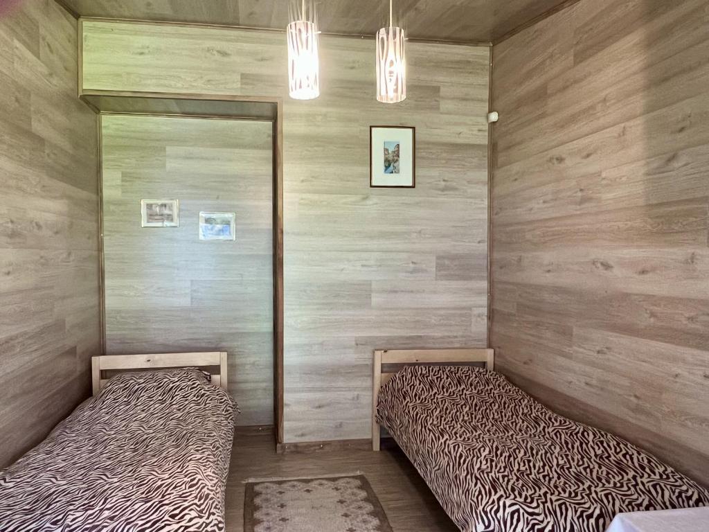 Postel nebo postele na pokoji v ubytování Vesiroos Villa