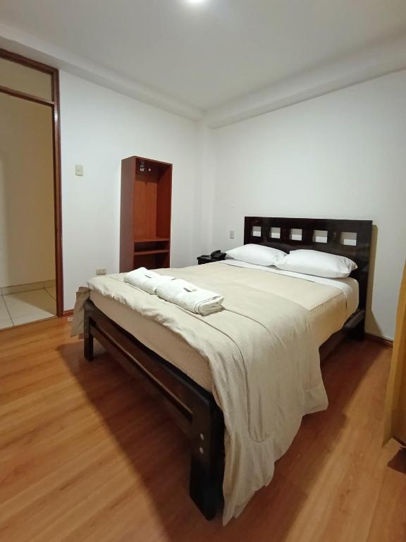 Ένα ή περισσότερα κρεβάτια σε δωμάτιο στο Hostal Atacama