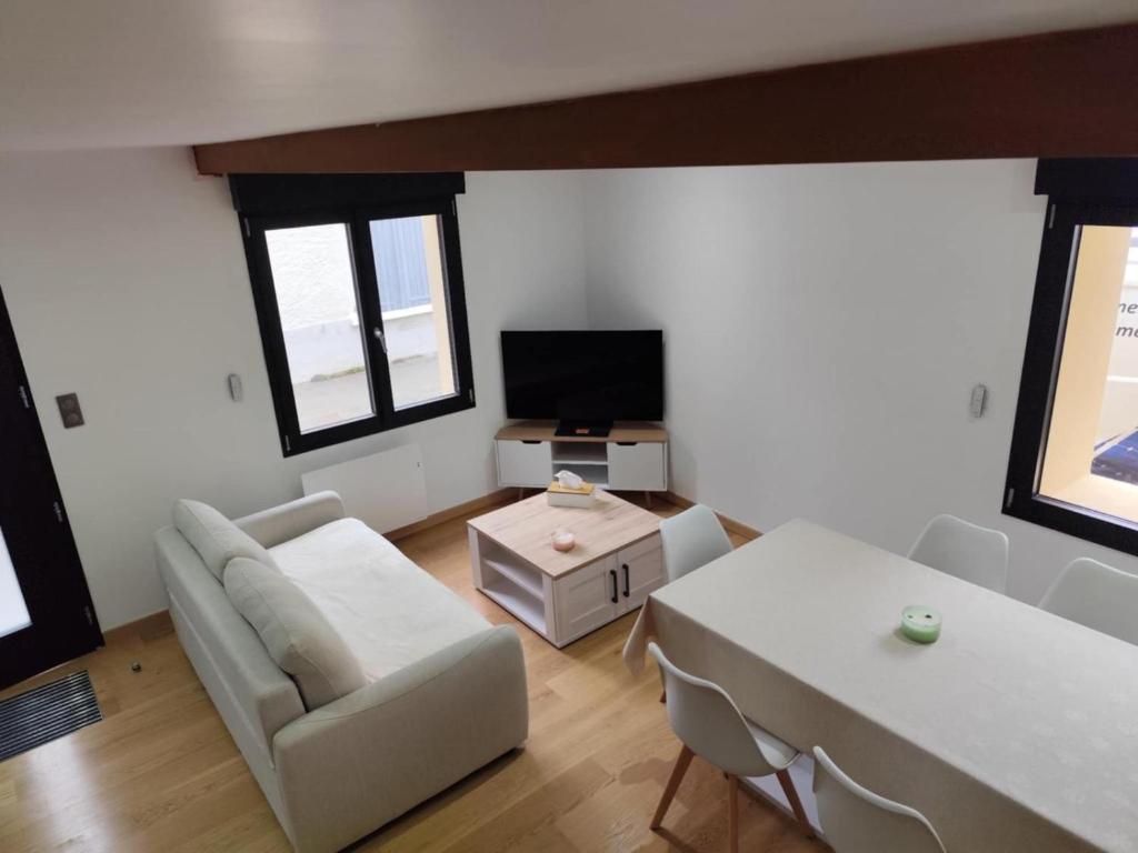 Гостиная зона в Maison au cœur de saint-Lary village