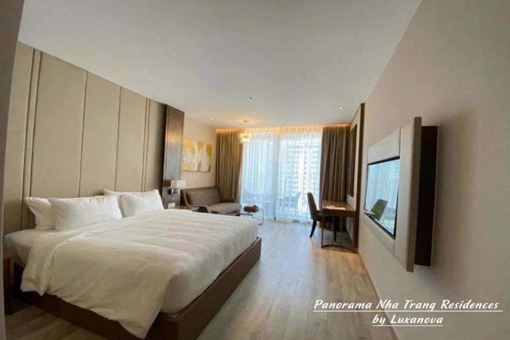 Postel nebo postele na pokoji v ubytování Panorama Nha Trang Residences by Luxanova