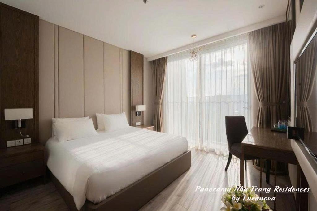Postel nebo postele na pokoji v ubytování Panorama Nha Trang Residences by Luxanova