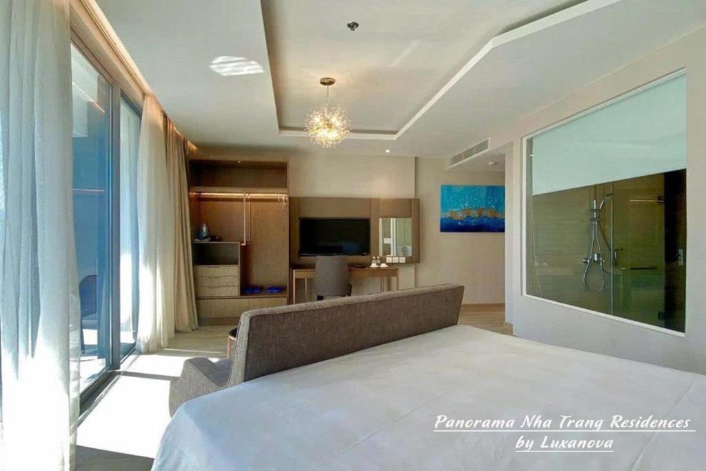 Postel nebo postele na pokoji v ubytování Panorama Nha Trang Residences by Luxanova