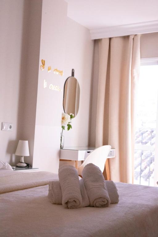 Postel nebo postele na pokoji v ubytování Hostal Cuevas