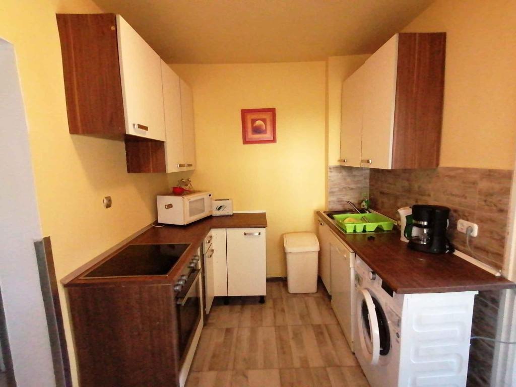 a small kitchen with a sink and a dishwasher at Holiday home in Balatonbereny 38081 in Balatonberény