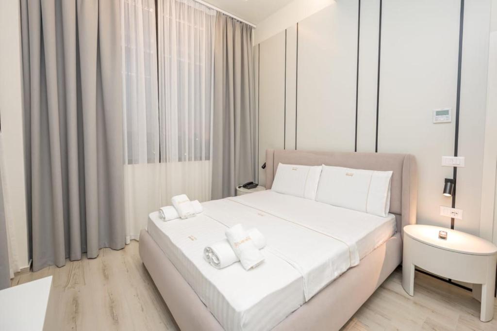 Postel nebo postele na pokoji v ubytování Laid Hotel