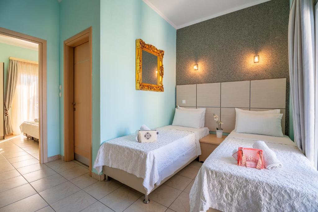Postel nebo postele na pokoji v ubytování Kaplanis House