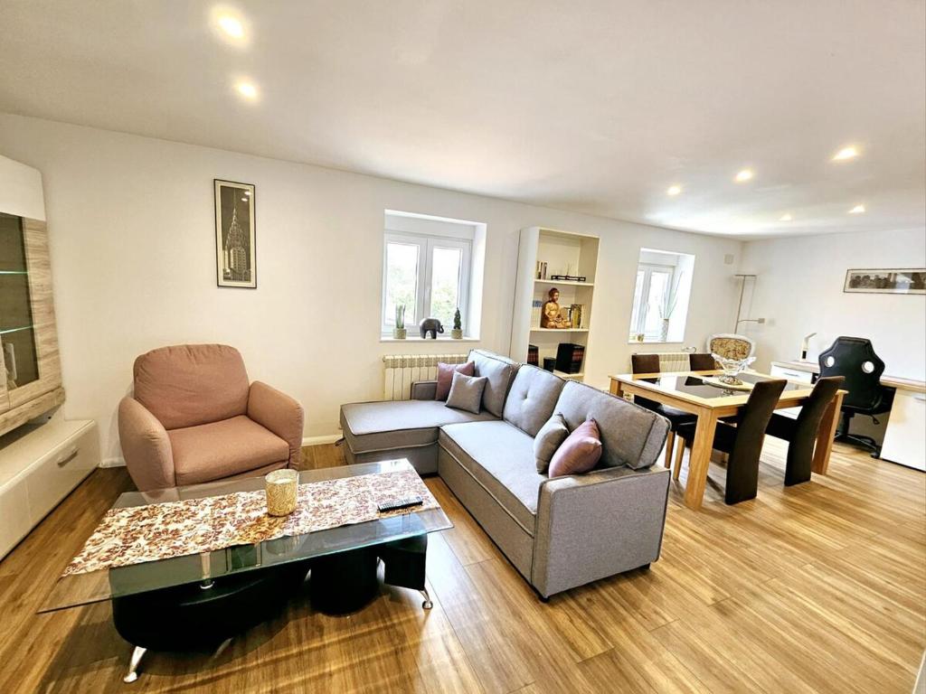 a living room with a couch and a table at Natur León Apartamento 60 m2 máximo 4 Huéspedes in Villafañé