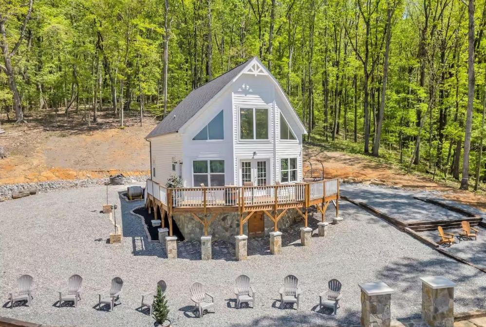 an overhead view of a house with a deck and chairs at Vineyard Cottage in Wine Country with Hot Tub in Jonesville