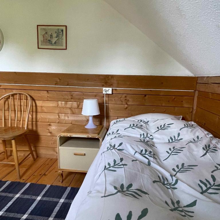 Postel nebo postele na pokoji v ubytování Klefstad gård
