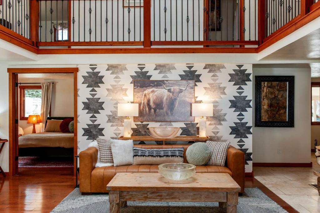 a living room with a couch and a table at Creek-Hot Tub-View-Pets-10min DT in Durango