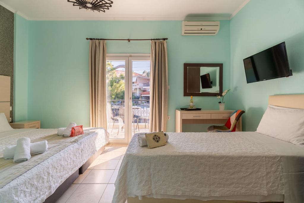 Postel nebo postele na pokoji v ubytování Kaplanis House
