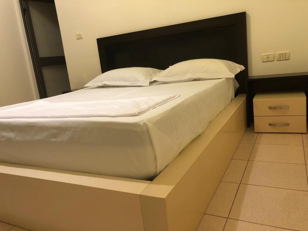 Postel nebo postele na pokoji v ubytování Hotel Xhej