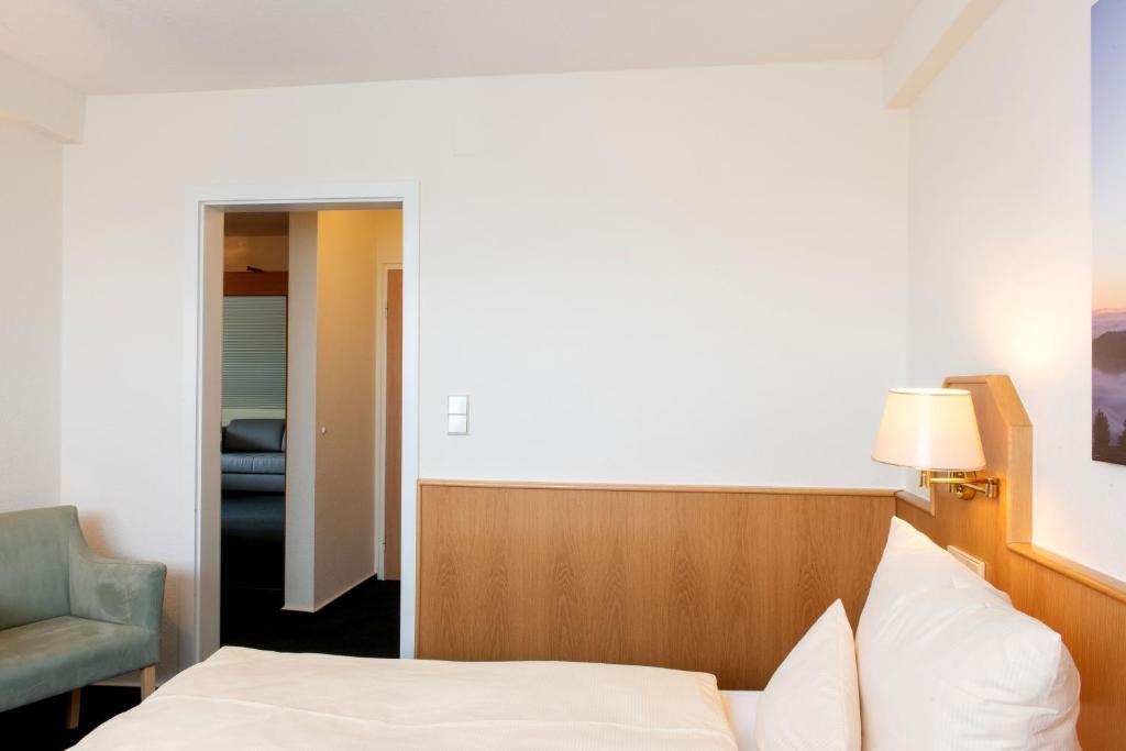 Postel nebo postele na pokoji v ubytování Hotel Fernblick