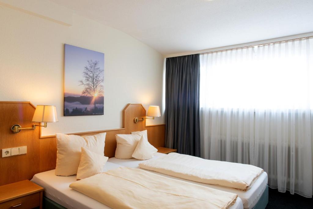Postel nebo postele na pokoji v ubytování Hotel Fernblick