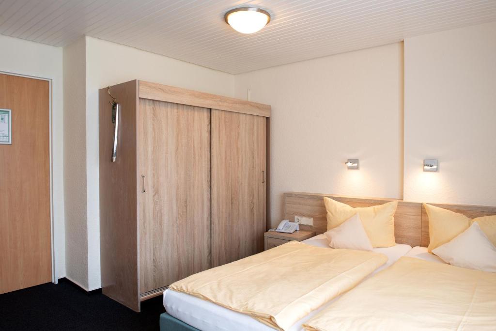 Postel nebo postele na pokoji v ubytování Hotel Fernblick
