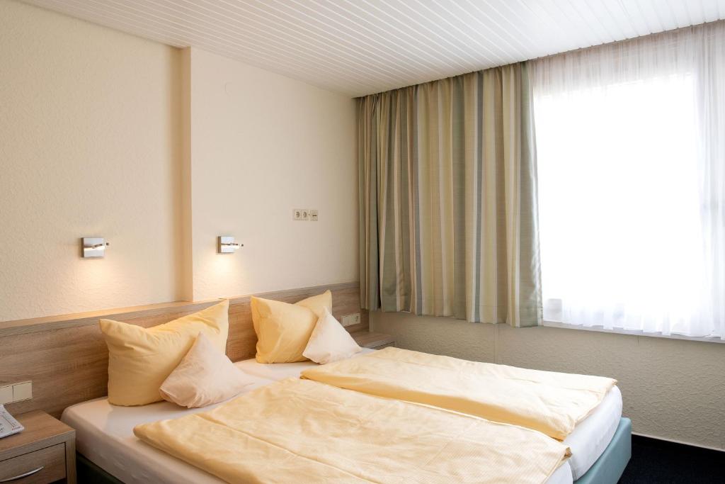 Postel nebo postele na pokoji v ubytování Hotel Fernblick