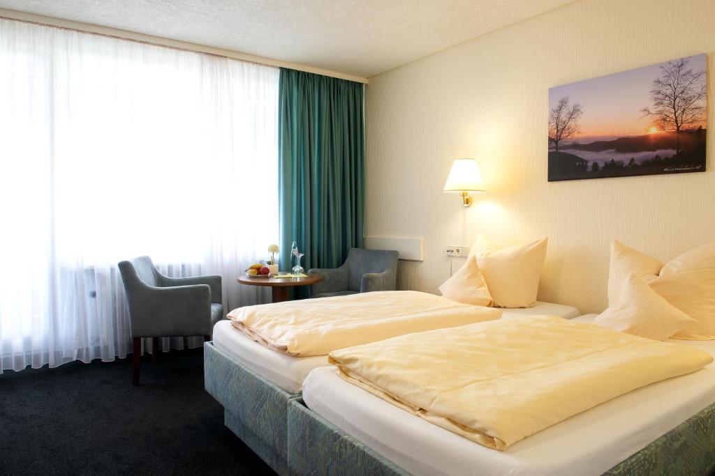 Postel nebo postele na pokoji v ubytování Hotel Fernblick