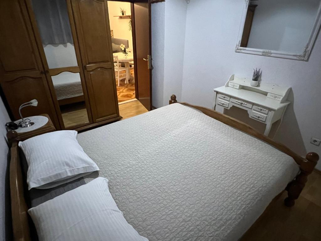 Postel nebo postele na pokoji v ubytování Apartman Mia
