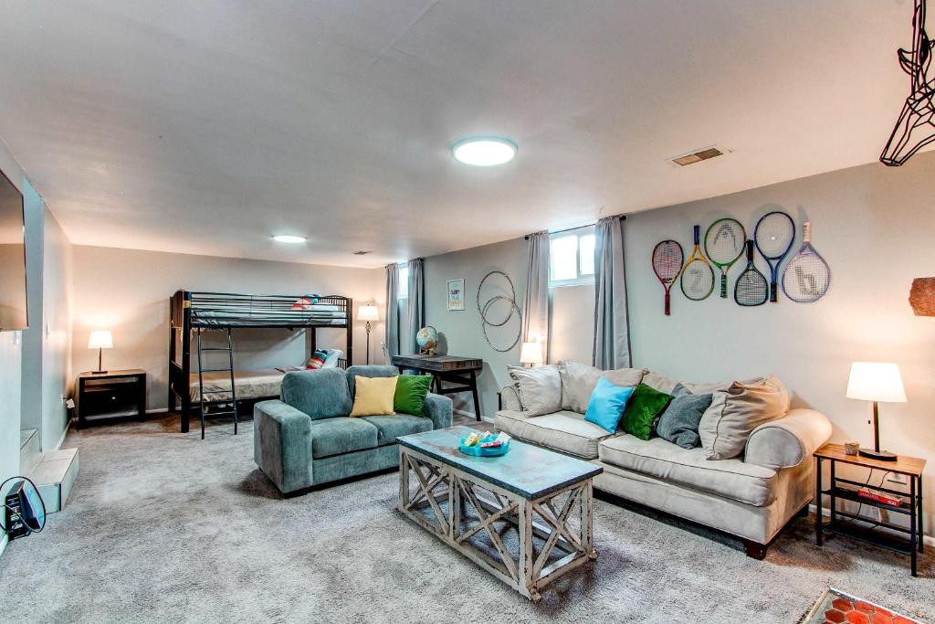 a living room with a couch and a bed at Spacious family home in Littleton with fenced yard in Littleton