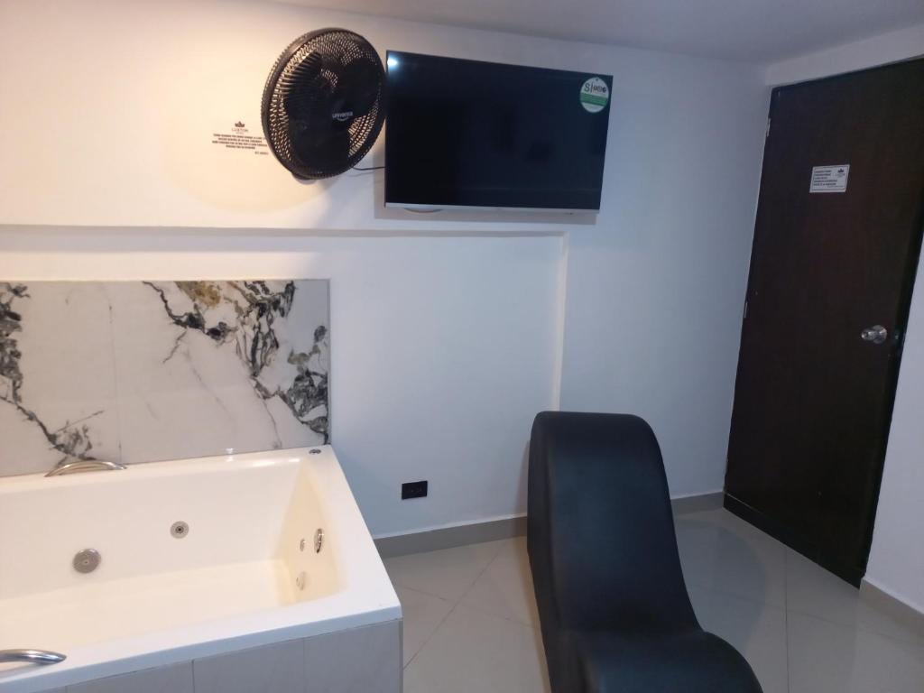 TV a/nebo společenská místnost v ubytování Hotel Centrica Del Palo 45
