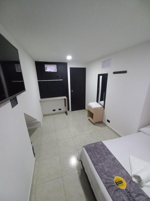 Postel nebo postele na pokoji v ubytování Hotel Centrica Del Palo 45