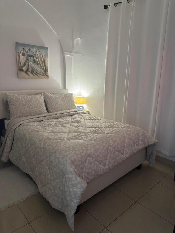Postel nebo postele na pokoji v ubytování Oasis Inn