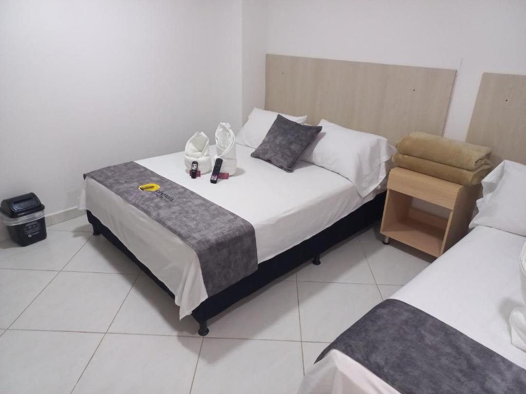 Postel nebo postele na pokoji v ubytování Hotel Centrica Del Palo 45