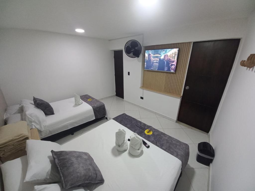 Postel nebo postele na pokoji v ubytování Hotel Centrica Del Palo 45