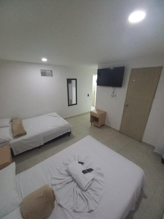 Postel nebo postele na pokoji v ubytování Hotel Centrica Del Palo 45