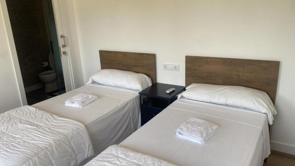 Postel nebo postele na pokoji v ubytování Albergue Villa San Clemente
