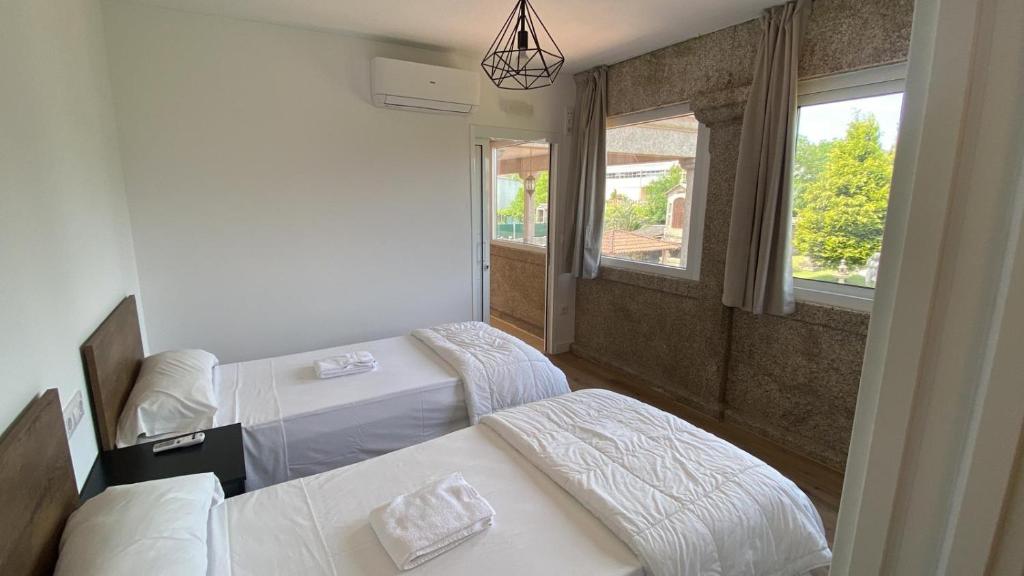 Postel nebo postele na pokoji v ubytování Albergue Villa San Clemente