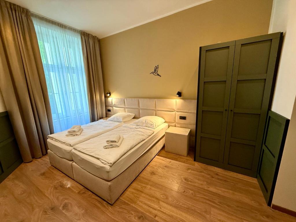 Łóżko lub łóżka w pokoju w obiekcie Luxury Residence Kmochova