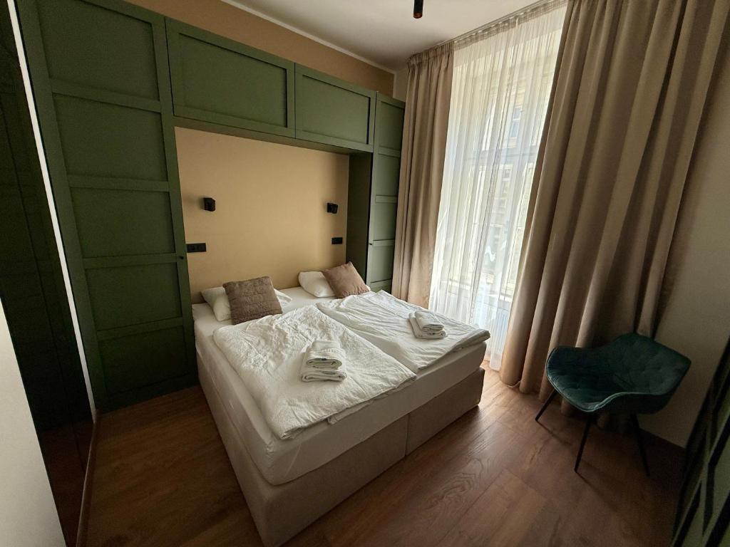 Łóżko lub łóżka w pokoju w obiekcie Luxury Residence Kmochova