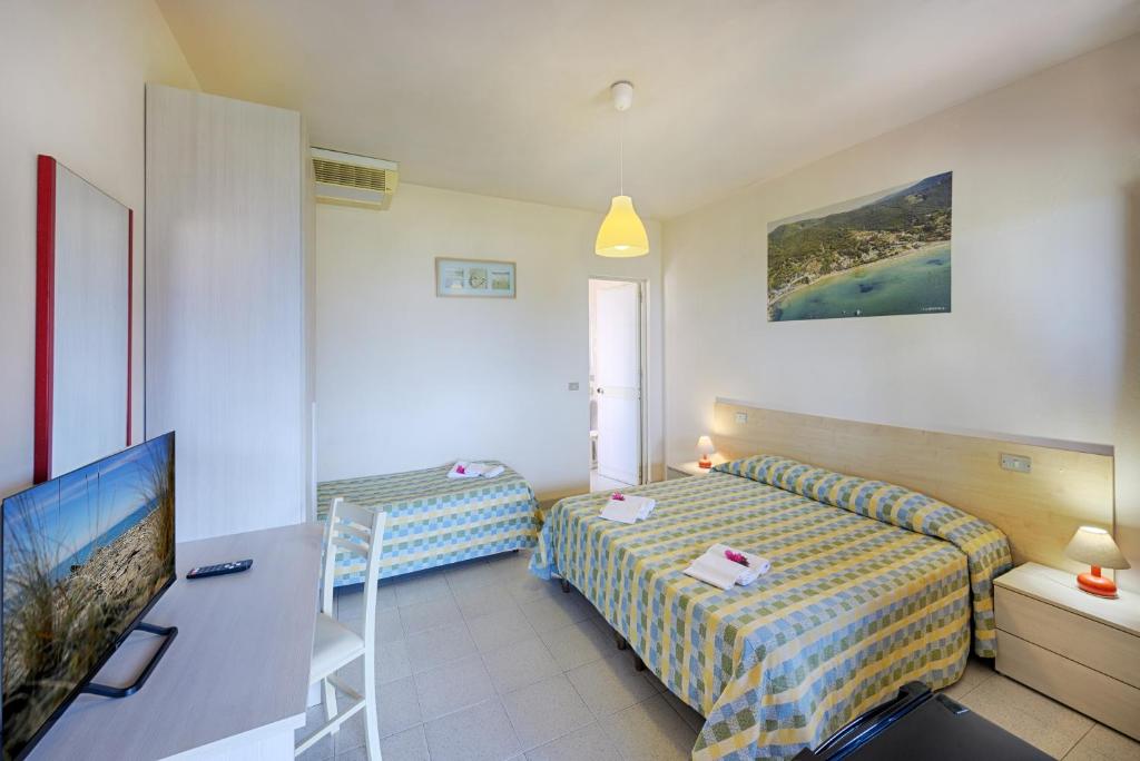 TV a/nebo společenská místnost v ubytování Hotel Casa Rosa