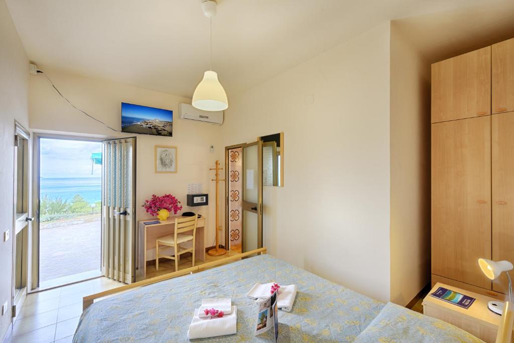 Postel nebo postele na pokoji v ubytování Hotel Casa Rosa