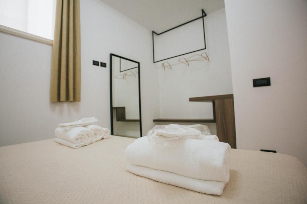 Postel nebo postele na pokoji v ubytování Dalia Suite & Relax