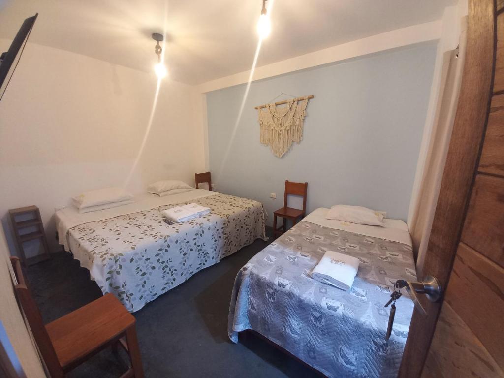 Voodi või voodid majutusasutuse Hospedaje Velilu toas